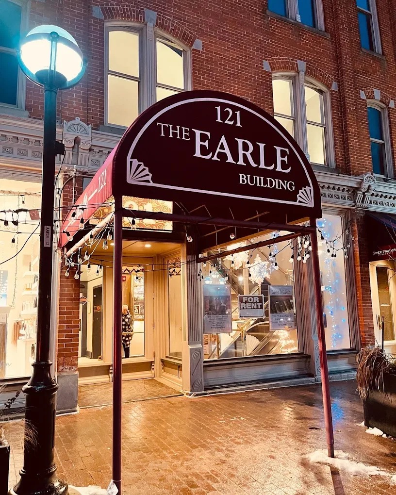 The Earle building storefront at night
